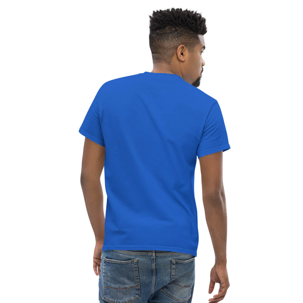 Front view of a blue t-shirt mockup on a male model with white placeholder text reading Your Design Here centered on the chest.
